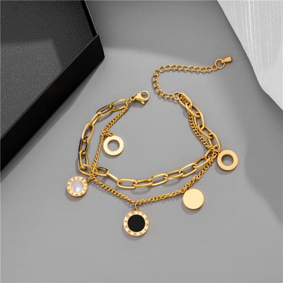 Bracciale Cerchi d’Oro con dettagli in madreperla e onice