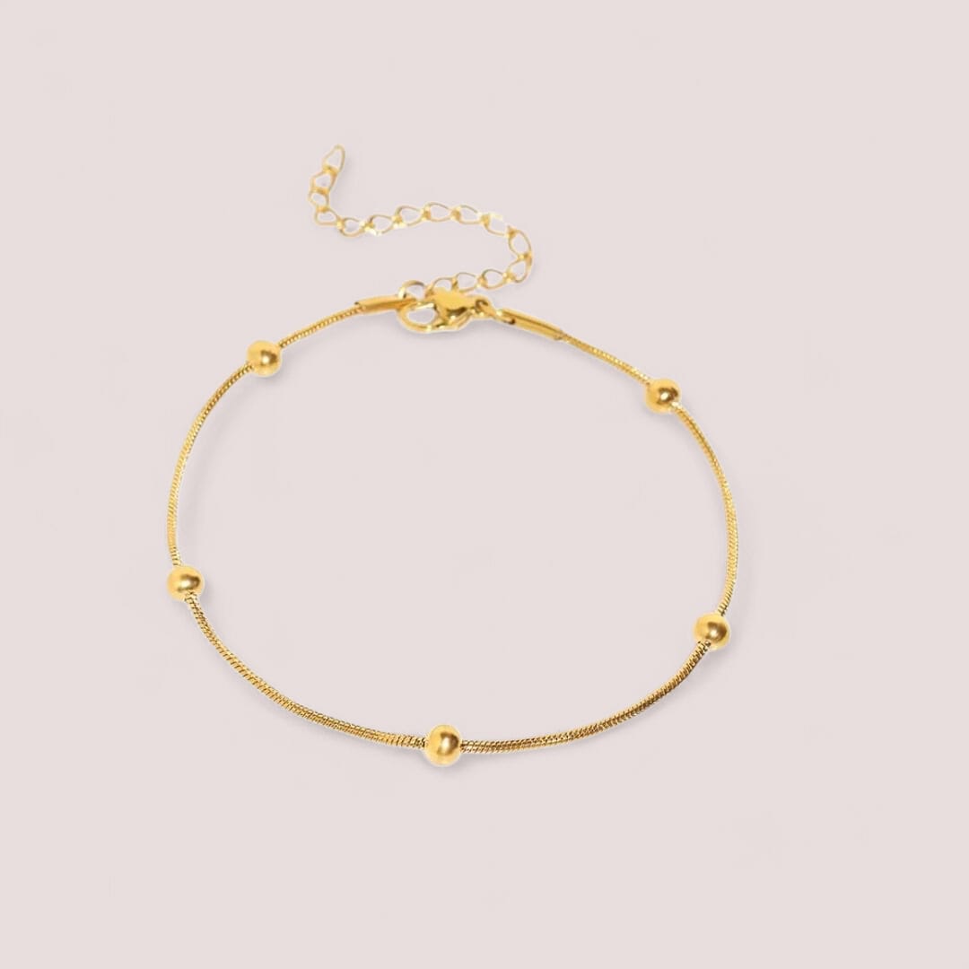 Bracciale Sottile con Sfere Dorate in Acciaio Inox