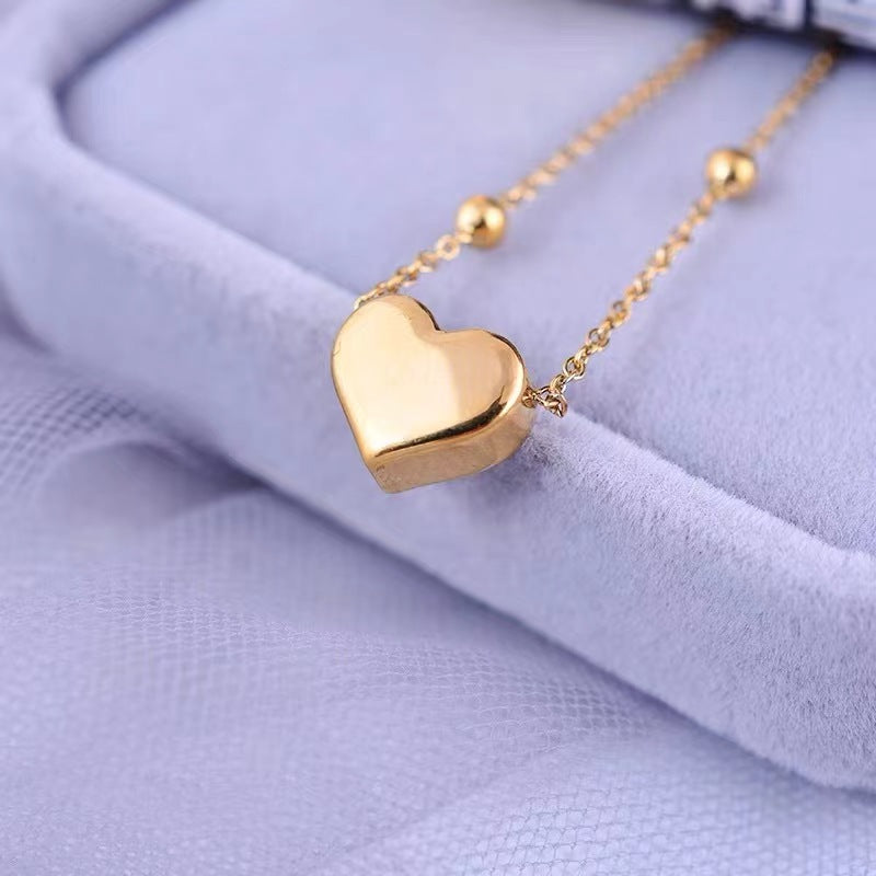 Bracciale perline con cuore in acciaio inox