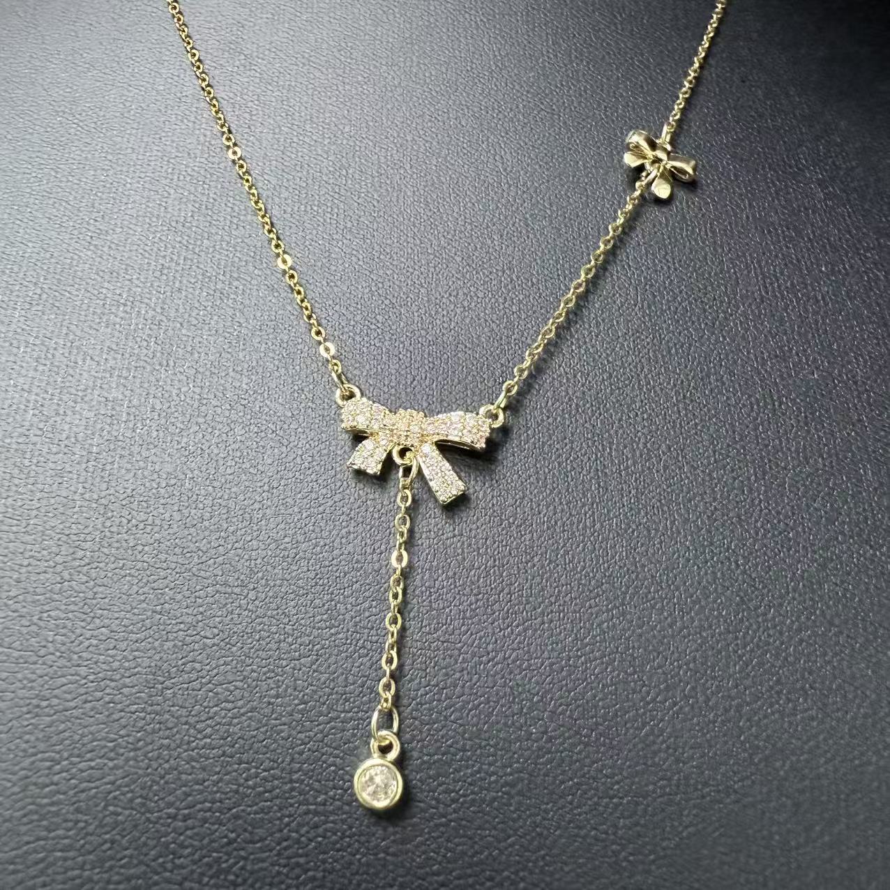 Collana con Fiocchetto e Diamante in Acciaio Inox