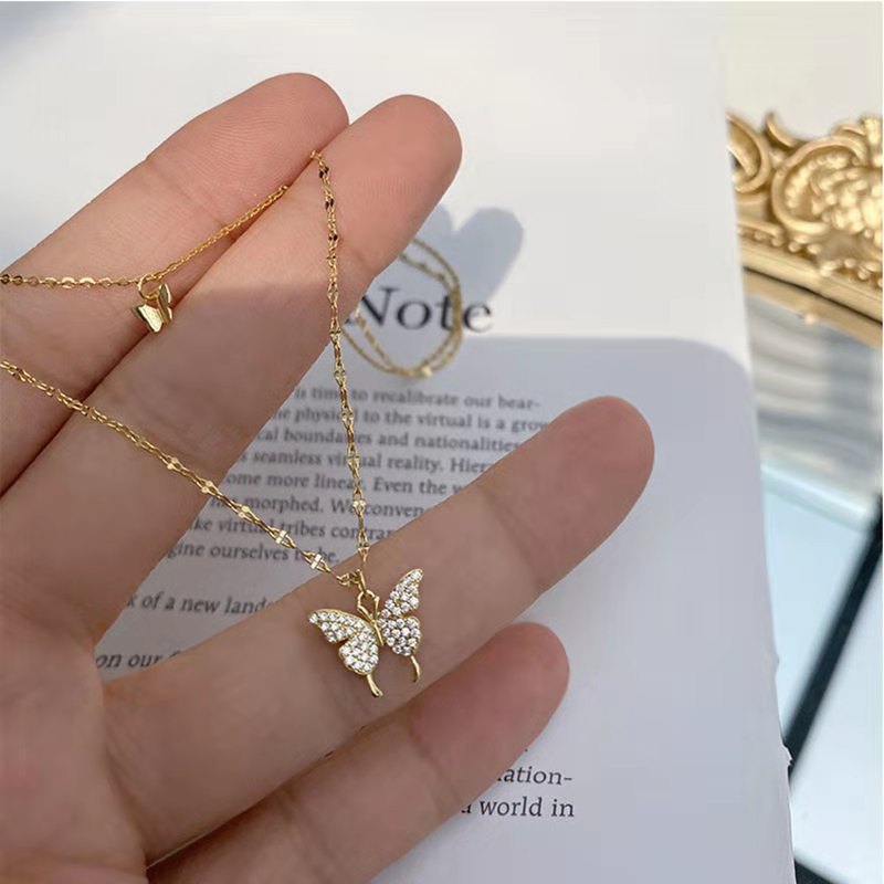 Collana con ciondolo a doppia farfalla in acciaio inox