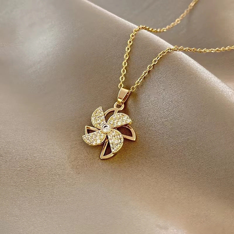 Collana rotante con ciondolo a forma di girasole
