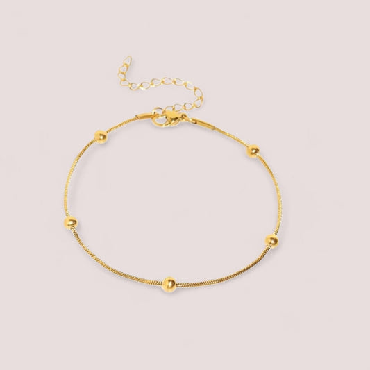 Bracciale Sottile con Sfere Dorate in Acciaio Inox